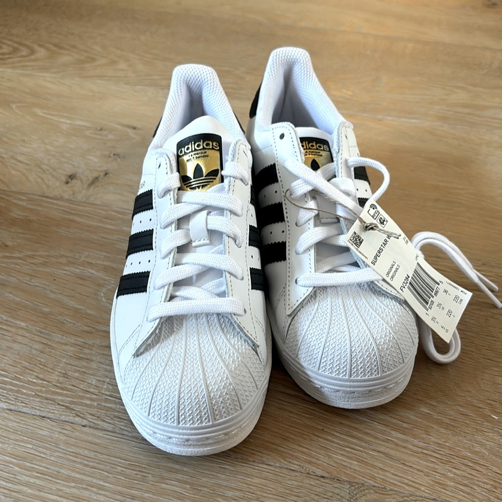 Adidas super star shoes.